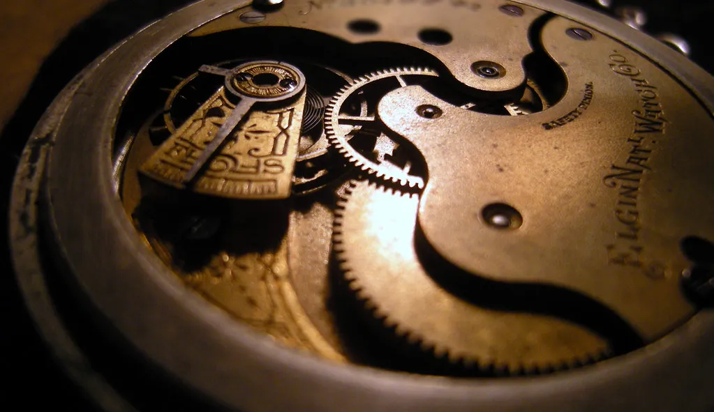 A macro close-up of interlocking brass clockwork gears